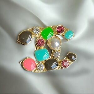 Elegant Designer Brooch with Jewel Tones